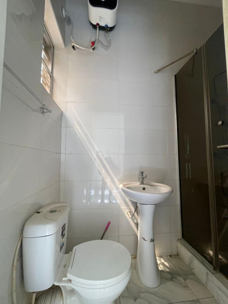 Spacious single room– Ikota Villa Estate (Close to Mega Chicken)