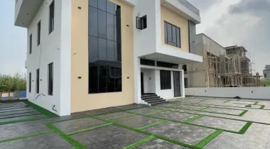 Luxury 5 bedroom fully detached duplex for sale in Chevron Lekki Lagos with swimming pool, elevator, and modern architectural design.