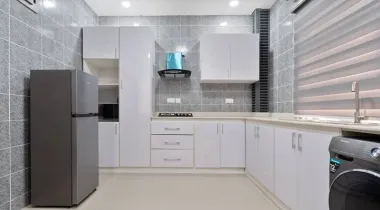 Kitchen equipped with fridge and washing machine