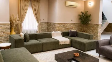 The Eniville Villa is a 3-bedroom, 2.5-bathroom home (2 ensuite) with two living rooms, a spacious kitchen, and a serene outdoor space perfect for relaxation or children’s play.