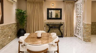 The Eniville Villa is a 3-bedroom, 2.5-bathroom home (2 ensuite) with two living rooms, a spacious kitchen, and a serene outdoor space perfect for relaxation or children’s play.