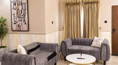 The Eniville Villa is a 3-bedroom, 2.5-bathroom home (2 ensuite) with two living rooms, a spacious kitchen, and a serene outdoor space perfect for relaxation or children’s play.