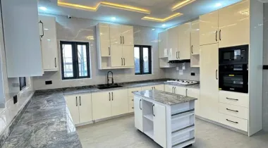 EXQUISITELY FINISHED LUXURY 4 BEDROOM FULLY DETACHED DUPLEX WITH  BQ, SWIMMING POOL, LAUNDRY ROOM AND It HAS A 3 LIVING ROOM AND A GATEHOUSE