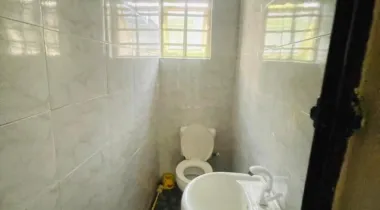 A room and parlor with two toilet  And private (closed ) kitchen 