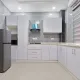 Kitchen equipped with fridge and washing machine