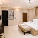 The Eniville Villa is a 3-bedroom, 2.5-bathroom home (2 ensuite) with two living rooms, a spacious kitchen, and a serene outdoor space perfect for relaxation or children’s play.