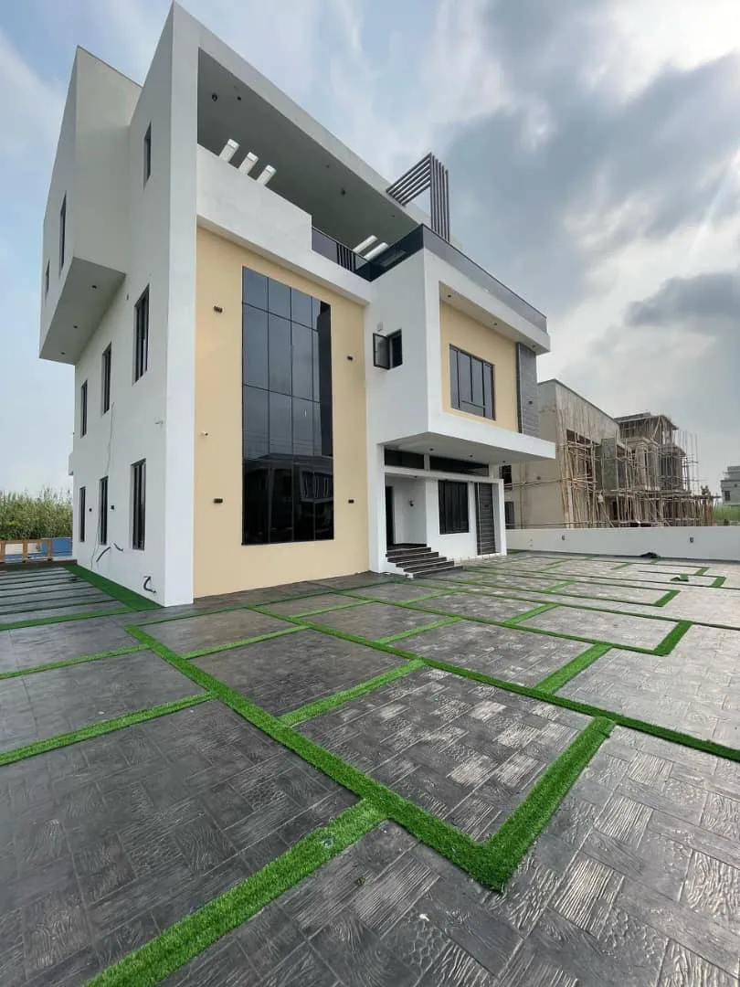 Luxury 5 bedroom fully detached duplex for sale in Chevron Lekki Lagos with swimming pool, elevator, and modern architectural design.
